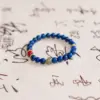 Wisdom Flame Bracelet — lapis lazuli & red agate bracelet